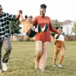 Family together playing after knowing they're covered with fixed indemnity health insurance