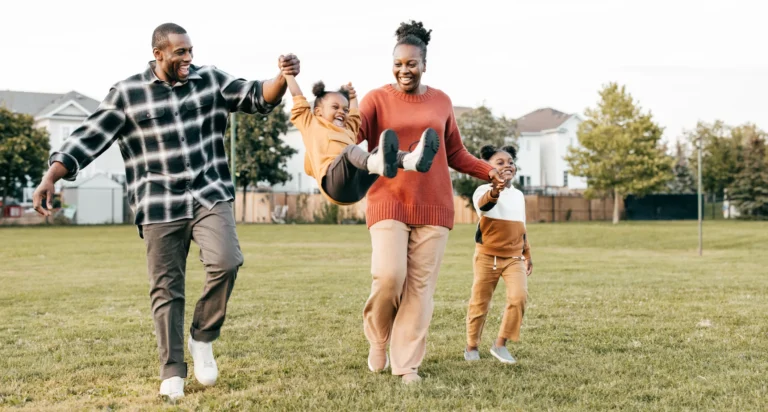 Family together playing after knowing they're covered with fixed indemnity health insurance