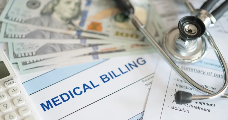 Medical billing statement next to $100 bills, a calculator and a stethoscope, representing out-of-pocket medical costs